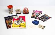 BARRY HUMPHRIES/ DAME EDNA EVERIDGE: Collection including signature on piece, theatre programmes, badges, stamps, books, Barry McKenzie mugs (5), print of Bill Leak cartoon. - 2