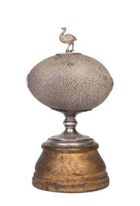 An Australian silver mounted emu egg trophy with emu finial and silver plaque "Dunolly Boxing Day Sports 1822, Licensed Victuallers Cup, 2 Mile Bicycle Race won by B.F. Neumann"