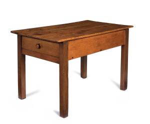A colonial Tasmanian scullery table, huon pine top with blackwood legs and single drawer at one end, 19th century