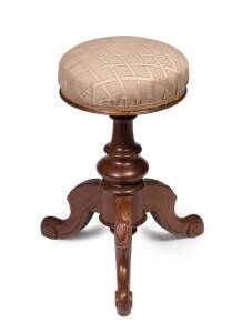 A rare Australian cedar revolving piano stool carved with gum leaves