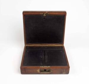 An embossed leather travelling writing box with silver presentation plaque"PRESENTED TO Rev. D John Anderson (with a purse of sovereigns) BY A FEW FRIENDS IN Free Talbooth Church Edinburgh as a parting memorial on his resigning. The Office of Missionary i