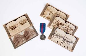 A Deli Durbar 1911 medal and 12 stereoview cards