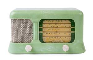 A Peter Pan green bakelite radio with clouds 