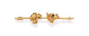 A gold bar brooch, set with two gold nuggets. Yellow gold.