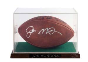 JOE MONTANA, signature on NFL football, in perspex display case, overall 32x22x20cm. With CoA.