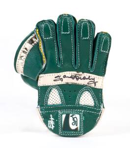 CRICKET AUTOGRAPHS: Kookaburra cricket ball signed by Dennis Lillee; plus mini-glove signed by Ian Healy.