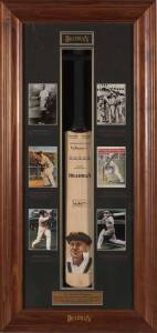 DON BRADMAN, attractive display comprising full size cricket bat with hand-painted portrait by Dave Thomas & signed by Don Bradman, mounted in display case together with 6 photos of Bradman, limited edition 228/334, overall 56x117cm.