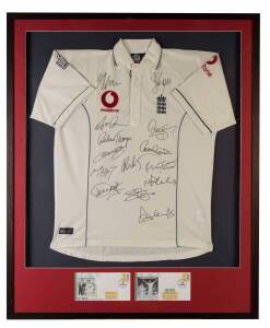 2005 ASHES: England Test shirt, signed on front by England team, 14 signatures including Michael Vaughan, Kevin Pietersen & Andrew Flintoff, window mounted, framed & glazed, overall 97x117cm. With CoA.