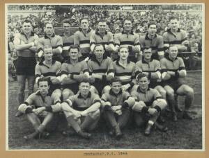 FOOTSCRAY/ WESTERN BULLDOGS: Group with 1946 team photograph; book "Sons of the Scray" signed by Ted Whitten; 1997 team poster with 38 signatures; poster "Whitten Oval 1925-1997" framed109x58cm. (4 items).