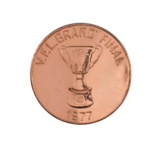 1977 NORTH MELBOURNE PREMIERS MEDAL, bronze medal, 38mm diameter, with "V.F.L.Grand Final/ (Premiership Cup)/ 1977" on front, and "North Melbourne F.C./ (Kangaroo)/ Premiers 1977" on reverse.