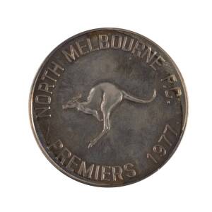 1977 NORTH MELBOURNE PREMIERS MEDAL, silver medal (for coach), 38mm diameter, with "V.F.L.Grand Final/ (Premiership Cup)/ 1977" on front, and "North Melbourne F.C./ (Kangaroo)/ Premiers 1977" on reverse, in original presentation case.