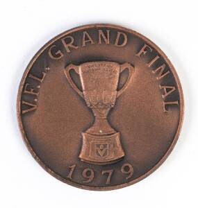 1979 GRAND FINAL BREAKFAST MEDAL, bronze medal, 38mm diameter, with "V.F.L.Grand Final/ (Premiership Cup)/ 1979" on front, and "North Melbourne F.C./ Annual Breakfast/ Compliments Brim Medallions Pty Ltd, Premiership Cup & Medallions, Norm Smith Medal & B