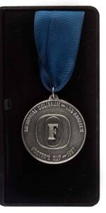 1987 VFL EXHIBITION MATCHES - FINAL: 18 Oct.1987 Melbourne v North Melbourne in Vancouver. Runners Up Medallion (engraved for Los Angeles Coliseum where match originally scheduled) in original case. [Melbourne 19.13.127 d North Melbourne 16.15.111].