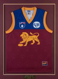 BRISBANE LIONS: 1997 display with Brisbane Lions jumper signed by coach John Northey & co-captains Michael Voss, Chris Johnson & Alistair Lynch, window mounted, framed & glazed, overall 77x101cm.