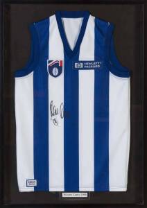 WAYNE CAREY, signature on North Melbourne jumper, window mounted, framed & glazed, overall 67x94cm.