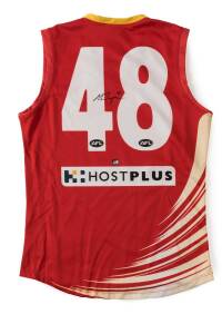 SEB TAPE'S GOLD COAST SUNS JUMPER, match worn in the Gold Coast's first win, over Port Adelaide, Round 5, April 23 2011, with number "48" and signature on reverse. In special display box, with AFL CoA.
