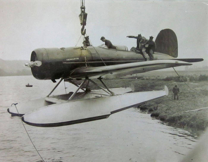 Collection of photographs. Charles A.Lindbergh (1933) press release photo with seaplane [nicely mounted in white card], Eildon Weir (1923) panoramas (2), panoramic group shot "Melbourne and Metropolitan Tramways....1932", Ormond College Melbourne, Family