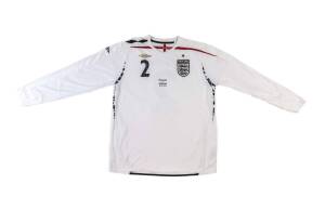 MICAH RICHARDS, match-worn England shirt, with number "2" & "England v Germany 22.08.2007" on front. [On making his full England debut in 2006, Richards became the youngest defender ever to be called up to the England squad, and went on to win 13 caps for