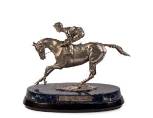 LESTER PIGGOTT: Sterling silver sculpture, "Lester Piggott, The Final Frame", produced by Garrard & Co., London to commemorate Piggott's retirement, limited edition 7/37 (one for each year of his career), signed by sculptor Edwina Emery, on a sodalite and