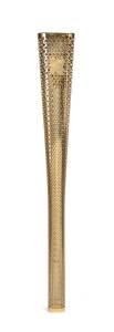 2012 LONDON OLYMPIC TORCH, gold-colored aluminum alloy, 80cm long, designed by Edward Barber and Jay Osgerby, made by The Premier Group, Coventry. Triangular form made out of an inner and outer sheet with 8000 holes representing the 8000 torch bearers in 