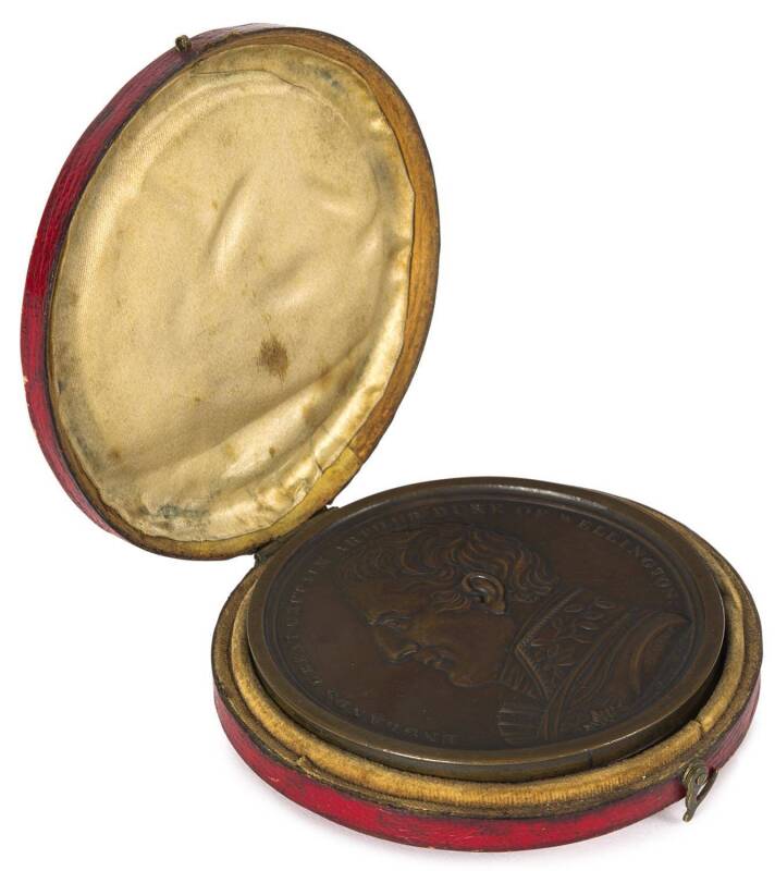 "The Battles of The British Army in Portugal, Spain and France - From the Year 1808-1814 Under the Command of Englands Great Captain Arthur Duke of Wellington" Circular bronze medallion case Â 'Englands Great Captain Arthur Duke of Wellington' surrounding