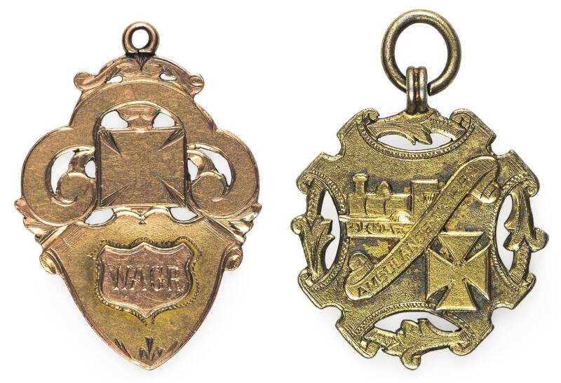 AUSTRALIA: WESTERN AUSTRALIA GOVt. RAILWAYS AMBULANCE CORPS:Â 1910 (25mm x 29mm, gold plated), 'AMBULANCE CORPS.' within diagonal scroll, steam train above and Maltese Cross below, suspension loop at top, rev. engraved 'SENIOR TEAM / COMPETITION / 1910 /