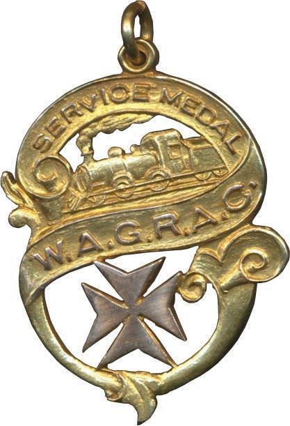 AUSTRALIA: WESTERN AUSTRALIA GOVt. RAILWAYS AMBULANCE CORPSÂ 1935 Service Medal (25mm x 35mm, 9ct Gold), 'SERVICE MEDAL / W.A.G.R.A.C.' within scroll surrounding steam train and cross of St.John, suspension loop at top, rev. engraved 'L. JONES / 1935', ma