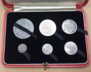 KGV: 1927 Six coin Proof set, 3d, 6d, 1/-, Florin, Half-Crown and Crown, in the issued red case with Coat of Arms in gold, most denominations toned.