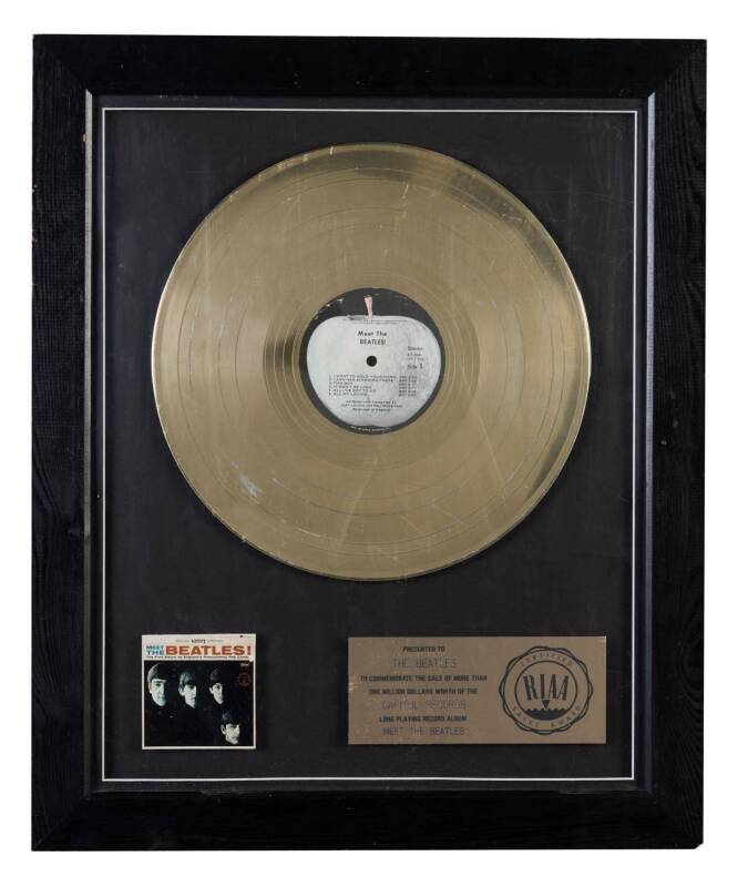 THE BEATLES: Gold Record for "Meet The Beatles!" (1964), with plaque "Presented to, The Beatles, To Commemorate the Sale of more than One Million Dollars Worth of the Capital Records Long Playing Record Album "Meet The Beatles", with RIAA logo, framed & g