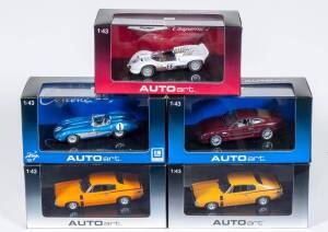 AUTO ART: 1:43 Group of Model Cars Including Aston Martin DB7 Red (50202); And, Chevrolet SS 1957 Blue (51051); And, Chaparral 2 Sport Racer 1965 (66596). All mint in original cardboard and plastic display case. (8 items)