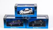 AUTO ART: 1:43 Group of Three Model Cars Including Nissan Skyline R34 GTR V-Spec II Black Pearl (57334); And, Honda Intergra Type R White (53241); And, Nissan Skyline R34 GTR 1999 Midnight Purple (57303). All mint in original cardboard packaging. (3 items