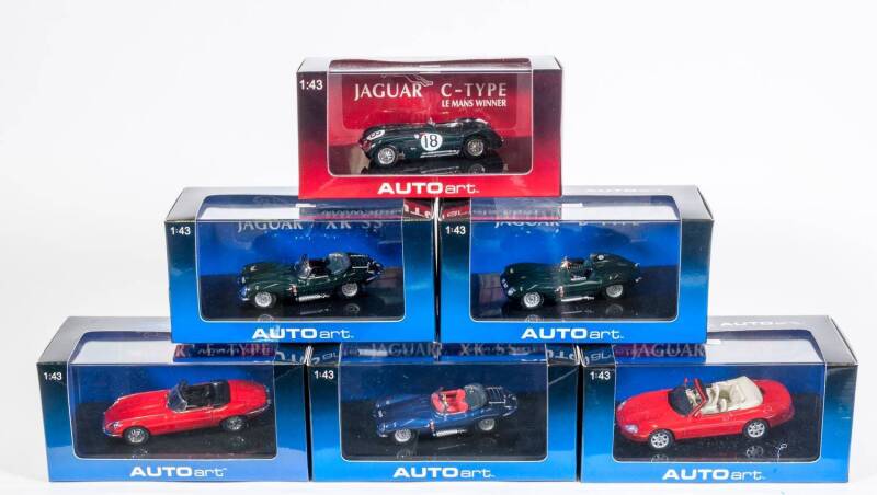 AUTO ART: 1:43 Group of Jaguar Model Cars Including Jaguar-D Type Short Nose Racing Green (53561); And, Jaguar XK SS Green (53752); And, Jaguar XK8 Cabrio Phoenix Red (53711). All mint in original cardboard packaging. (16 items)