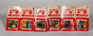 MATTEL: Group of Hotwheels 'Zowees' Including Baby Buggy (4927); And, Beddy Bye (4930); And, Bumble Seat (8589). All mint on original cards. (6 items)