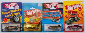 MATTEL: Group of 1980’s Hotwheels Including ‘Ultra Hots’ Flaming Runner (7293); And, ‘The Hot Ones’ Camaro Z-28 (5182); And, ‘Real Riders’ Black Lightning (9544). All mint and unopened on original cardboard cards. (40 items)