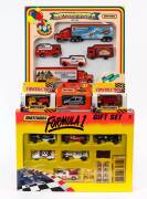 MATCHBOX: Group of Model Cars Including Formula 1 Gift Set (37730.20); And, Harley-Davidson Gift Set (76272), And, Construction Dump Truck (53). All mint in original cardboard packaging. (20 items)