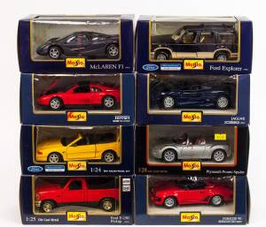 MAISTO: 1:24 Group of Model Cars Including 1992 Jaguar XJ220; And, 1990 Ferrari 348ts; And, Porsche 911 Speedster. All mint in original cardboard packaging. (8 items)