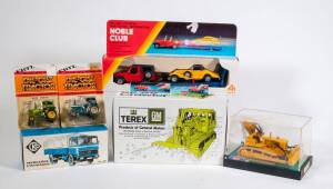 Group of Miscellaneous Model Vehicles Including CKO: Mercedes Lastwagen (431); And, GESCHA: Caterpillar Bulldozer; ERTL: Ford Tractor with Cab (1621). All mint in original cardboard packaging. (40 items approx.)