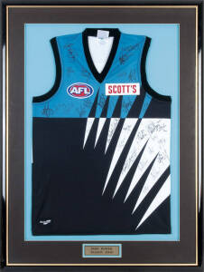 PORT ADELAIDE: Port Adelaide football jumper signed by team for 2000 Season, with 32 signatures, window mounted, framed & glazed, overall 81x108cm.