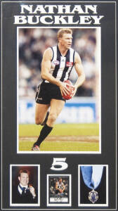 NATHAN BUCKLEY (Collingwood), display with signed football card, window mounted with action photograph, and another photograph of him wearing his 2003 Brownlow Medal, window mounted, framed & glazed, overall 60x93cm. With CoA.