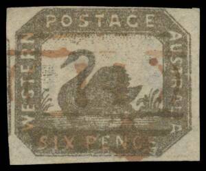 West Aust: 1857-59 Hillman Lithographs 6d black-bronze SG 18, an unusually large example with margins just clear to large & with a fragment of the adjoining unit at left, small thin at right, '14'-grid cancel of Albany, guarantee handstamps of Calves and 