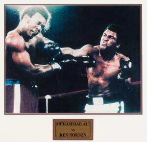 MUHAMMAD ALI, display with signature on pair of "Everlast" boxing shorts, window mounted, framed & glazed, overall 92x79cm. Plus framed photographs of Muhammad Ali v Joe Frazier & Muhammad Ali v Ken Norton.
