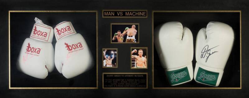ANTHONY MUNDINE & DANNY GREEN, 'Man Vs Machine' display comprising 2 pairs of boxing gloves signed by Mundine (signatures faded) & Danny Green, window mounted, framed & glazed, overall 118x50cm.