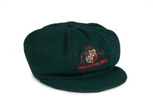 DON BRADMAN'S 1934 AUSTRALIAN "BAGGY GREEN" TEST CAP, green wool, wire-embroidered Australian Coat-of-Arms & "1934" on front, Farmers label inside endorsed "D.G.Bradman". Few small moth holes, otherwise good match-worn condition.Provenance: Bradman origin