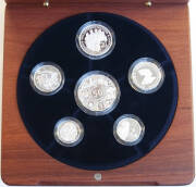 FINE SILVER PROOF SETS; 2003 Volunteers, 2004 Standard Issue and 2006 Decimal 40th. All with wooden cases and certificates. Cat. $820.