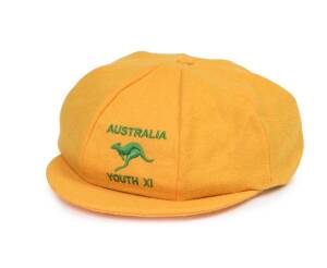 AUSTRALIA YOUTH XI CRICKET CAP, yellow wool, embroidered "AUSTRALIA/ (kangaroo)/ YOUTH XI" on front. Ex Jack Potter, the first AIS Cricket Academy head coach (1988-90), who taught Shane Warne to bowl a flipper. 