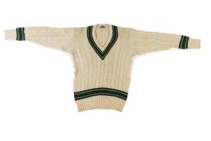 ALAN CONNOLLY'S AUSTRALIAN TEST JUMPER, long sleeves, cream wool with green & gold trimmings, with name tag "A.Connolly". [Alan Connolly played 29 Tests 1963-71].