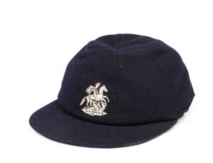 GEOFF BOYCOTT'S ENGLAND TOURING TEST CAP, navy blue wool, embroidered St.George & Dragon on front, named inside "G.Boycott" and endorsed "1979-80". Good condition. [Geoff Boycott played 108 Tests 1964-82].