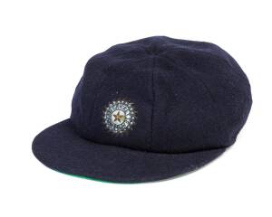 MADAN LAL'S INDIAN TEST CAP, blue wool with wire embroidered Indian logo on front. Good condition. Provenance: Broght to Tasmania for Don Wigan by Bishen Bedi when he played with Latrobe in 1981-82. [Madan Lal played 39Tests & 67 ODIs for India 1974-87].