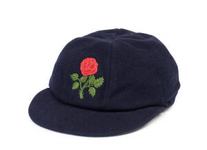 JACK SIMMONS' LANCASHIRE CRICKET CAP, from 1983, blue wool, lovely embroidered Rose logo on front. Good match-worn condition. [Jack Simmons played 450 first class matches for Lancashire & Tasmania 1967-89].