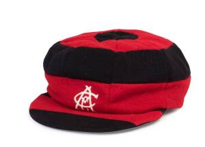 PAUL McEWAN'S CANTERBURY (NZ) CRICKET CAP, red & black bands, with "CCA" monogram on front, named inside "P.McEwan". Good match-worn condition. [Paul McEwan played 4 Tests & 17 ODIs for NZ 1980-85].